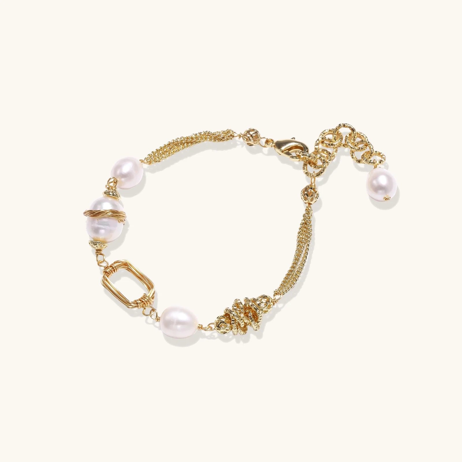 14K gold plated bracelet with freshwater pearls, filigree details, and mixed geometric elements on white background.