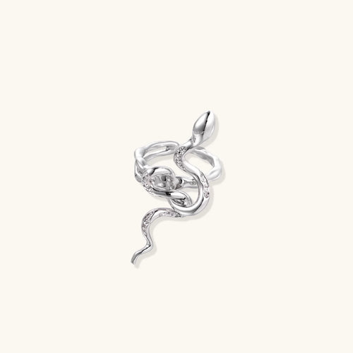 Sculptural white gold-plated snake ring with crystal accents coiling around finger in bold open design