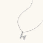 Letter H jewelry set featuring geometric crystal design in gold and white gold plated finish with adjustable chain necklace
