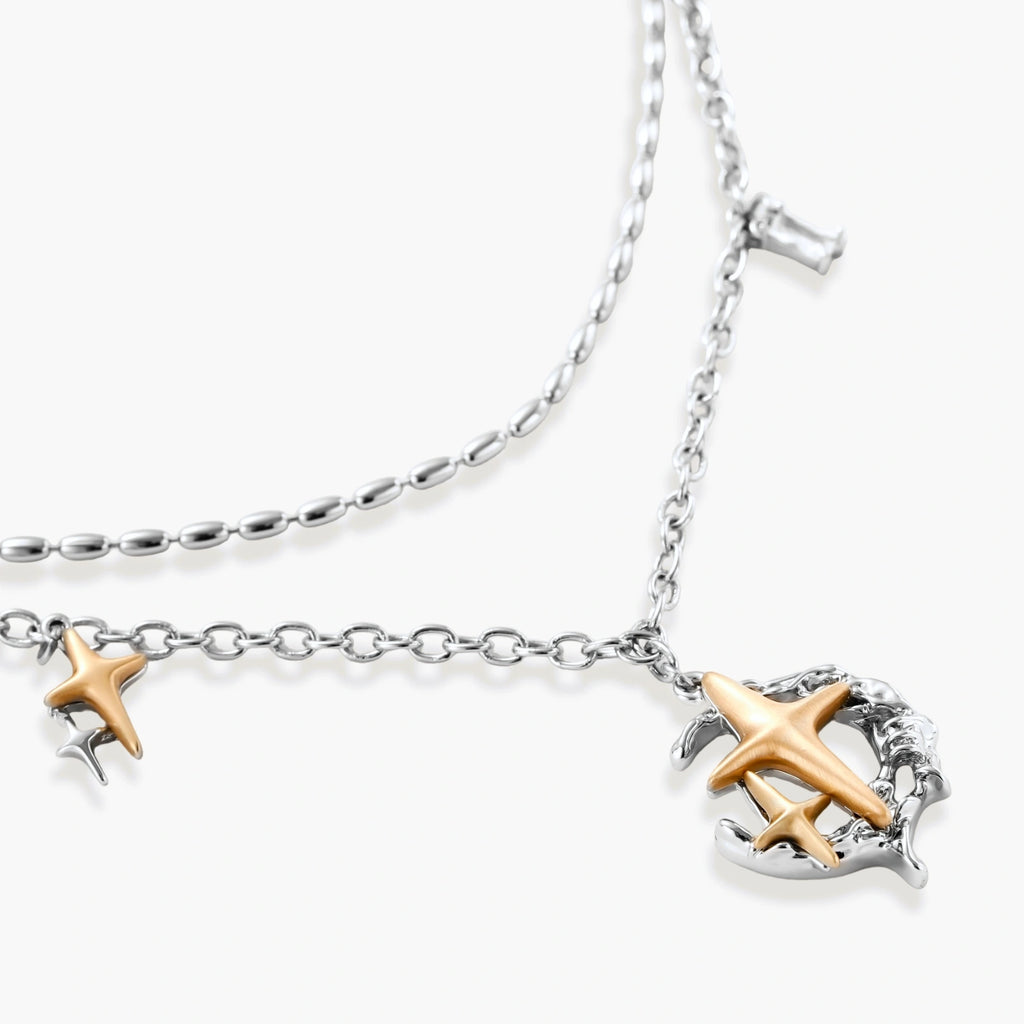 Layered silver-tone necklace set featuring star charms and crescent moon pendant with eco-friendly zinc alloy construction
