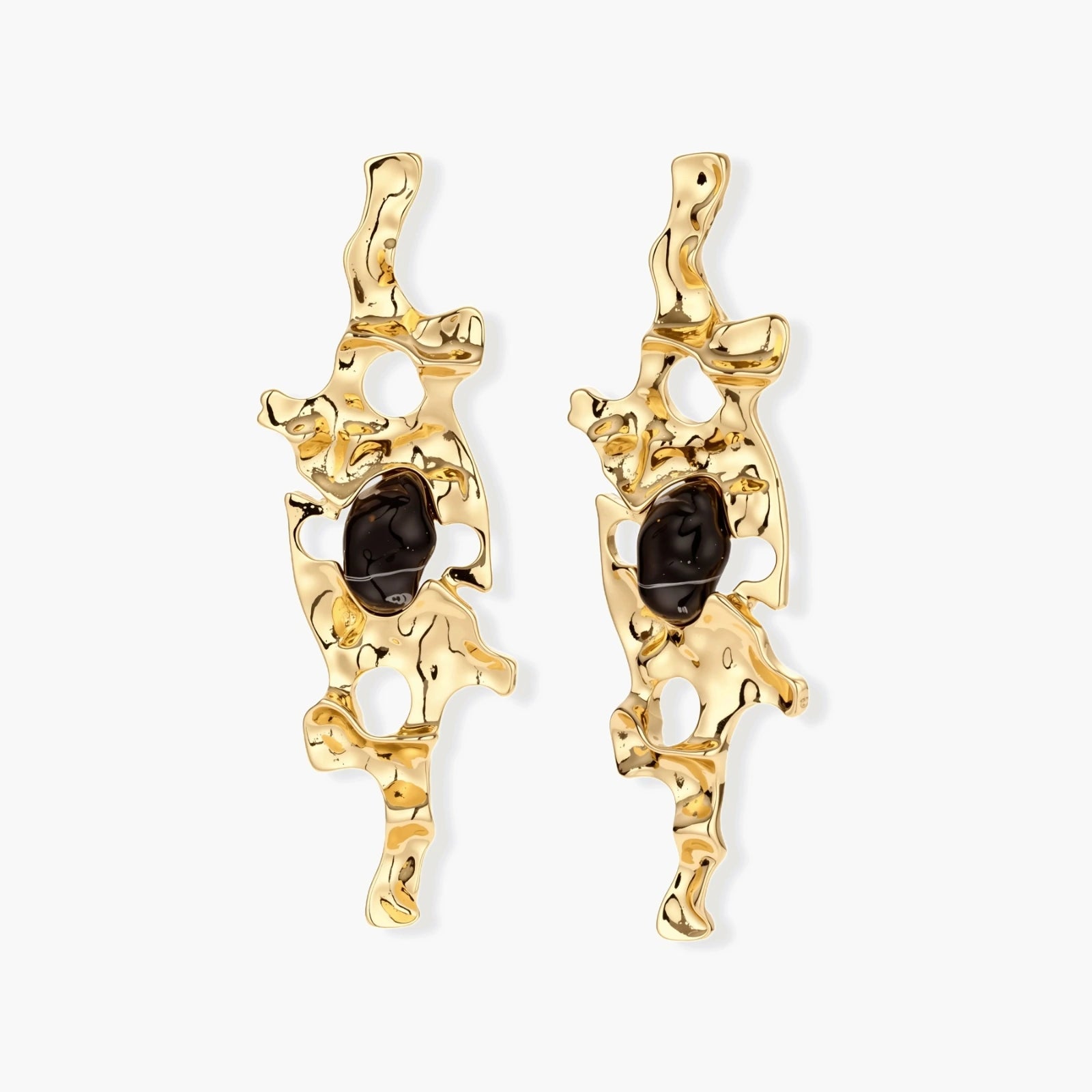 Elongated sculptural earrings with organic openwork design in eco-zinc alloy and dark resin accents on white background.