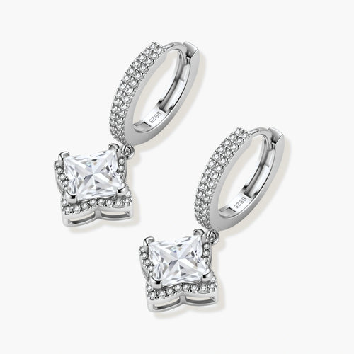 Sterling silver huggie hoops with geometric diamond-shaped moissanite dangles featuring pavé crystal details
