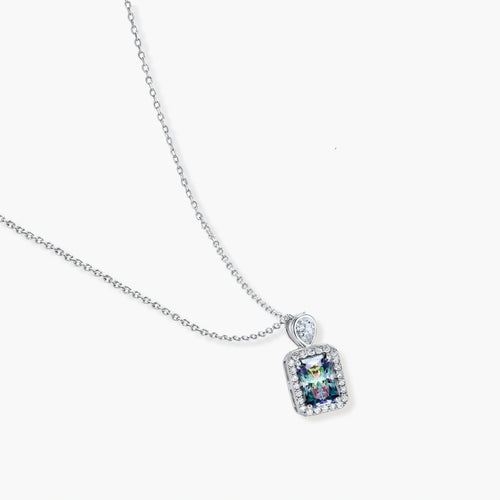 Sterling silver necklace with rectangular rainbow moissanite pendant and teardrop accent stone on white background