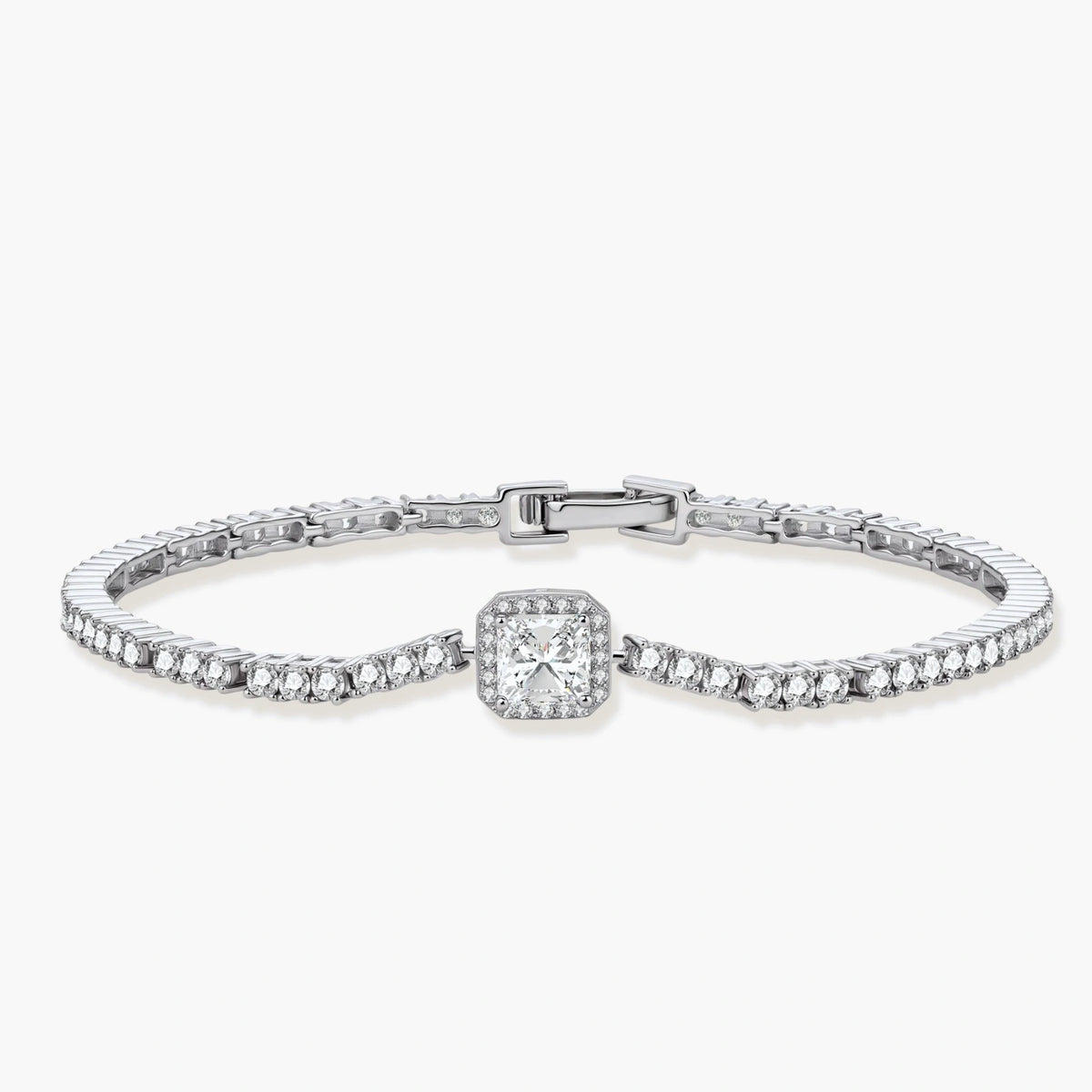 Sterling silver tennis bracelet with cushion-cut moissanite centerpiece surrounded by smaller stones in continuous setting