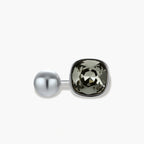 Modern adjustable ring with smoky zircon stone and metallic sphere in platinum-plated copper finish on neutral background.